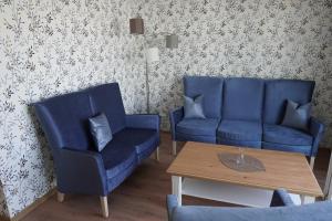 Posezení v ubytování ISA Rheinquartier - Moderne und barrierefreie Ferienapartments