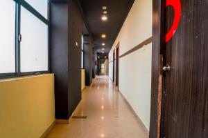 a hallway of an office building with a long corridor at FabExpress Chennai Central in Chennai