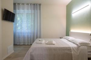 Postel nebo postele na pokoji v ubytování B&B Al Parco