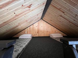 a room with two beds in the inside of a tent at СвояХата in Svityazʼ