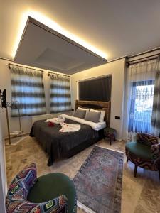 Postel nebo postele na pokoji v ubytování Dirilis Banarya Apart hotel