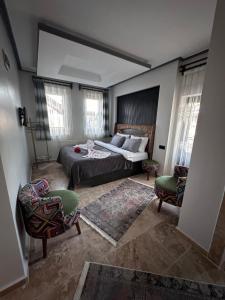 Postel nebo postele na pokoji v ubytování Dirilis Banarya Apart hotel