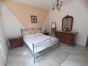Postel nebo postele na pokoji v ubytování Villa Giò