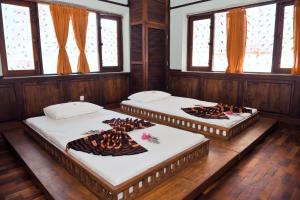 Postel nebo postele na pokoji v ubytování Villa Inle Boutique Resort