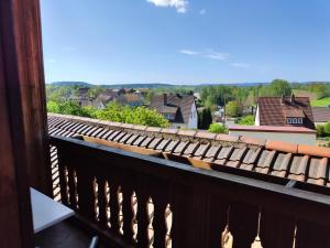 a balcony with a view of a town at Pension Hubertushöhe in Kulmbach
