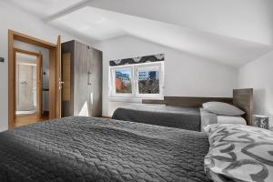 Кровать или кровати в номере Dormir Apartments