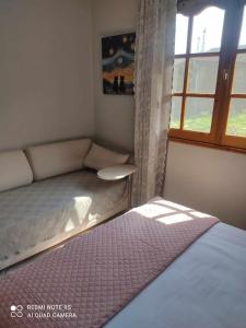 Postel nebo postele na pokoji v ubytování Thea apartments 1