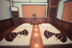 Postel nebo postele na pokoji v ubytování Villa Inle Boutique Resort
