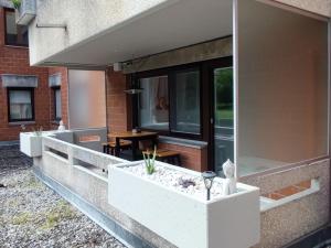 a building with a planter on the side of it at Apartment Feldkirch in Feldkirch