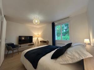 Postel nebo postele na pokoji v ubytování Le Clos des Lilas + 30 fotografií