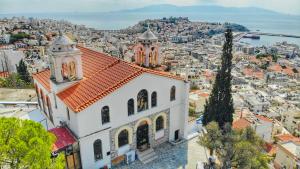 a church with a view of a city at Kaléstia in Kavala