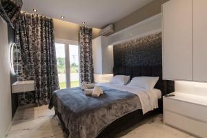 Postel nebo postele na pokoji v ubytování Evelina Luxury Suites in Corfu