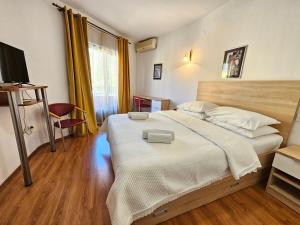Llit o llits en una habitació de Hotel Prvan