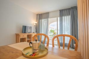 TV a/nebo společenská místnost v ubytování Apartamentos Royal Life