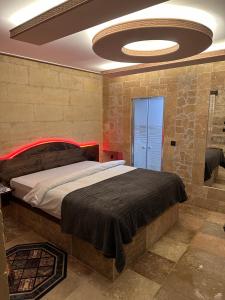 Postel nebo postele na pokoji v ubytování Dirilis Banarya Apart hotel