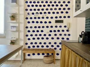 a kitchen with blue and white tiles on the wall at La Casa del Pescatore n 33 - porto di St Spirito Bari in Bari