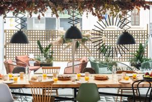 a table with food and drinks on a patio at Ibis Barcelona Plaza Glòries 22@ in Barcelona