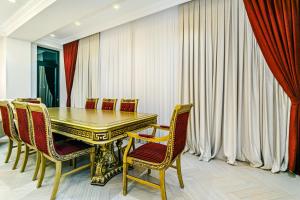 a dining room with a table and chairs at Deluxe Apartment 15/1 in Baku