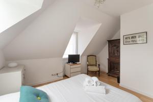 Postel nebo postele na pokoji v ubytování La Petite Enogatine - A moins d'un km de la plage