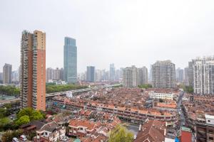 an aerial view of a city with tall buildings at Hills&Coloured glaze Homestay in Shanghai