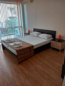 Ένα ή περισσότερα κρεβάτια σε δωμάτιο στο Апартаменти СЪНИ БЕЙ +40 φωτογραφίες