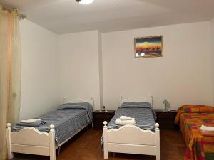 Postel nebo postele na pokoji v ubytování Stanze private in appartamento + 6 fotografií