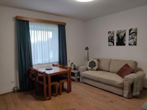 a living room with a couch and a table at Neuhof in Neuhofen an der Ybbs