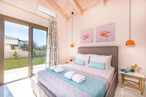 Postel nebo postele na pokoji v ubytování Villa Levanta by Villa Plus + 19 fotografií