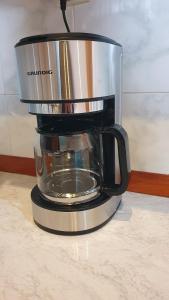 a coffee pot sitting on top of a coffee maker at Apart-Hotel David in Tbilisi City