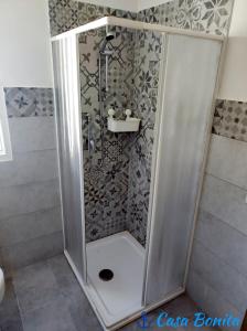 a shower with a glass door in a bathroom at Casa Bonita pachino Tiny House in Pachino