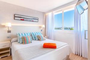 Postel nebo postele na pokoji v ubytování VIVA Eden Lago