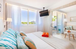 Postel nebo postele na pokoji v ubytování VIVA Eden Lago