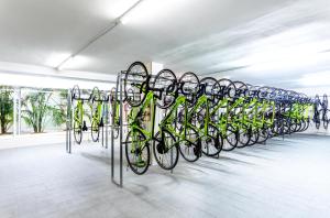 a row of bikes parked in a bike rack at VIVA Blue & Spa in Playa de Muro