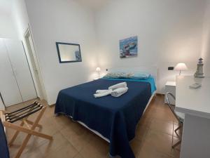 a bedroom with a bed with two towels on it at B&B Scala dei Turchi Beach in Realmonte