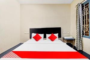Een bed of bedden in een kamer bij Hotel Signature Homes