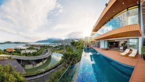 a view of a building with a swimming pool at Ocean Beach Villa Nha Trang in Nha Trang