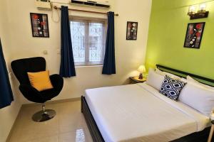 Ένα ή περισσότερα κρεβάτια σε δωμάτιο στο Bungalow Dona Spacious 4BHK in Dona Paula +21 φωτογραφίες
