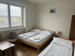Postel nebo postele na pokoji v ubytování Penzion Znojmo