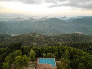 an overhead view of a mountain valley with a swimming pool at Simpson's Forest Hotel in Kandy