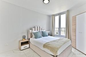 Postel nebo postele na pokoji v ubytování Appartement moderne proche Paris - Gagny