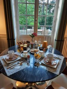 a blue table with food on top of it at Maison Cuevas in Biarritz