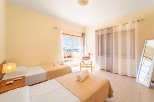Postel nebo postele na pokoji v ubytování Villa Galé + 32 fotografií