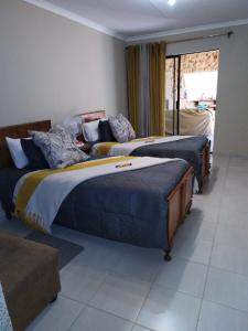 Ένα ή περισσότερα κρεβάτια σε δωμάτιο στο Carstens Cove
