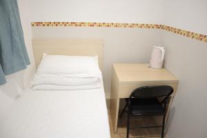 Posteľ alebo postele v izbe v ubytovaní Hoi To Hostel