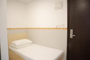 Posteľ alebo postele v izbe v ubytovaní Hoi To Hostel