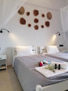 a bedroom with two beds with donuts on the wall at Makis Apartments in Arillas