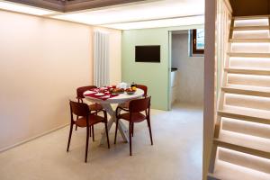 a dining room with a table and chairs at Luxury apartment SS Annunziata in Florence