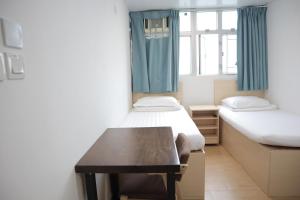 Posteľ alebo postele v izbe v ubytovaní Hoi To Hostel