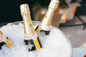 two bottles of champagne in a bucket of snow at DeGrassi Boutique Garni Hotel Izola in Izola