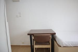 Posteľ alebo postele v izbe v ubytovaní Hoi To Hostel